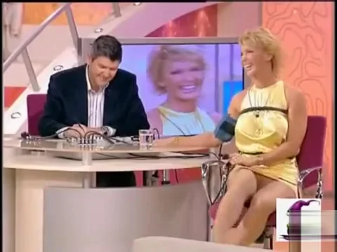 Italian diva in a short yellow dress shows off her long legs