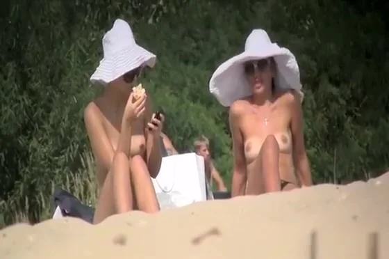Nude and topless women in beach