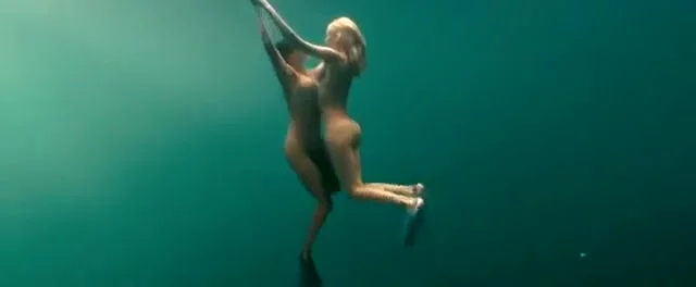 Busty naked swimmers make erotic underwater art