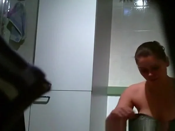 Busty chick spied in bathroom taking a pee