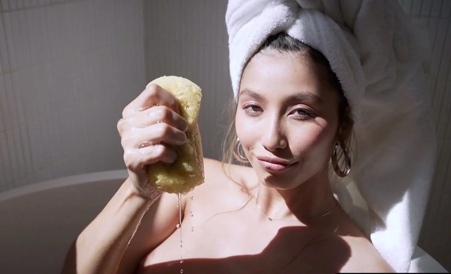 Big tits petite Latina strips in bathtub
