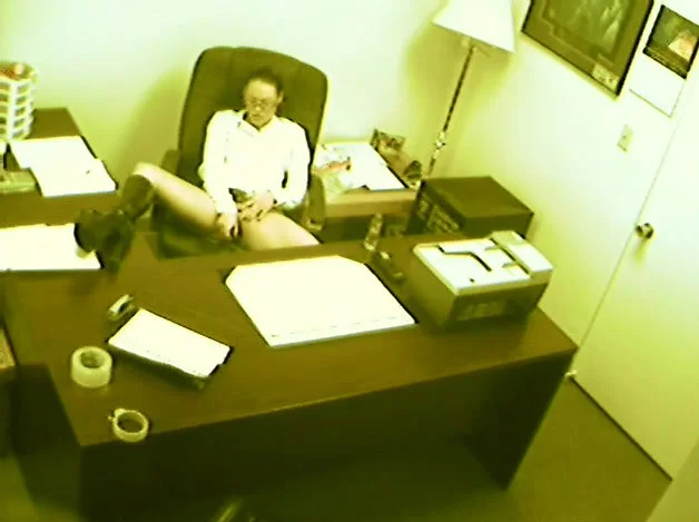 Naughty secretary gets caught on camera getting off at the office