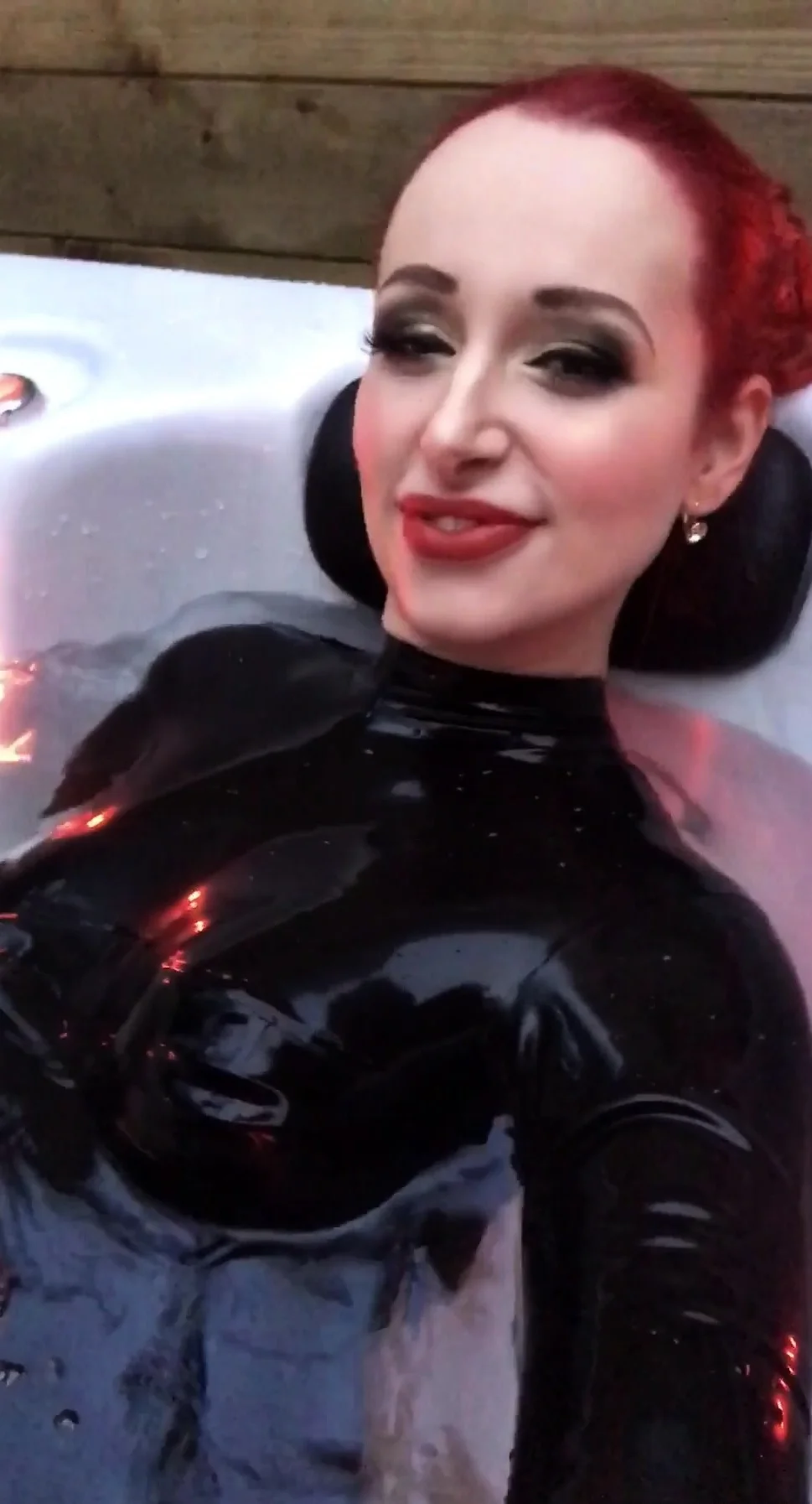 Dhorny redhead in latex sucks a huge penis