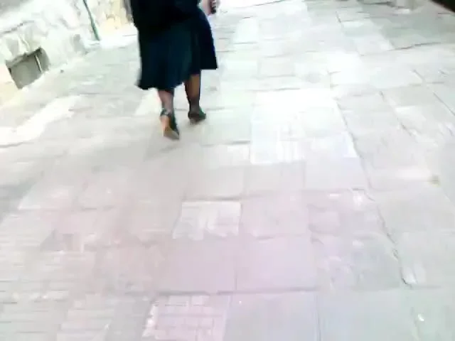 Mature babe walking in black heels