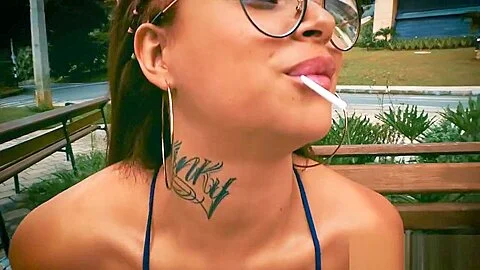 Laura Monroy plays with a lollie pop in a park in Medellin