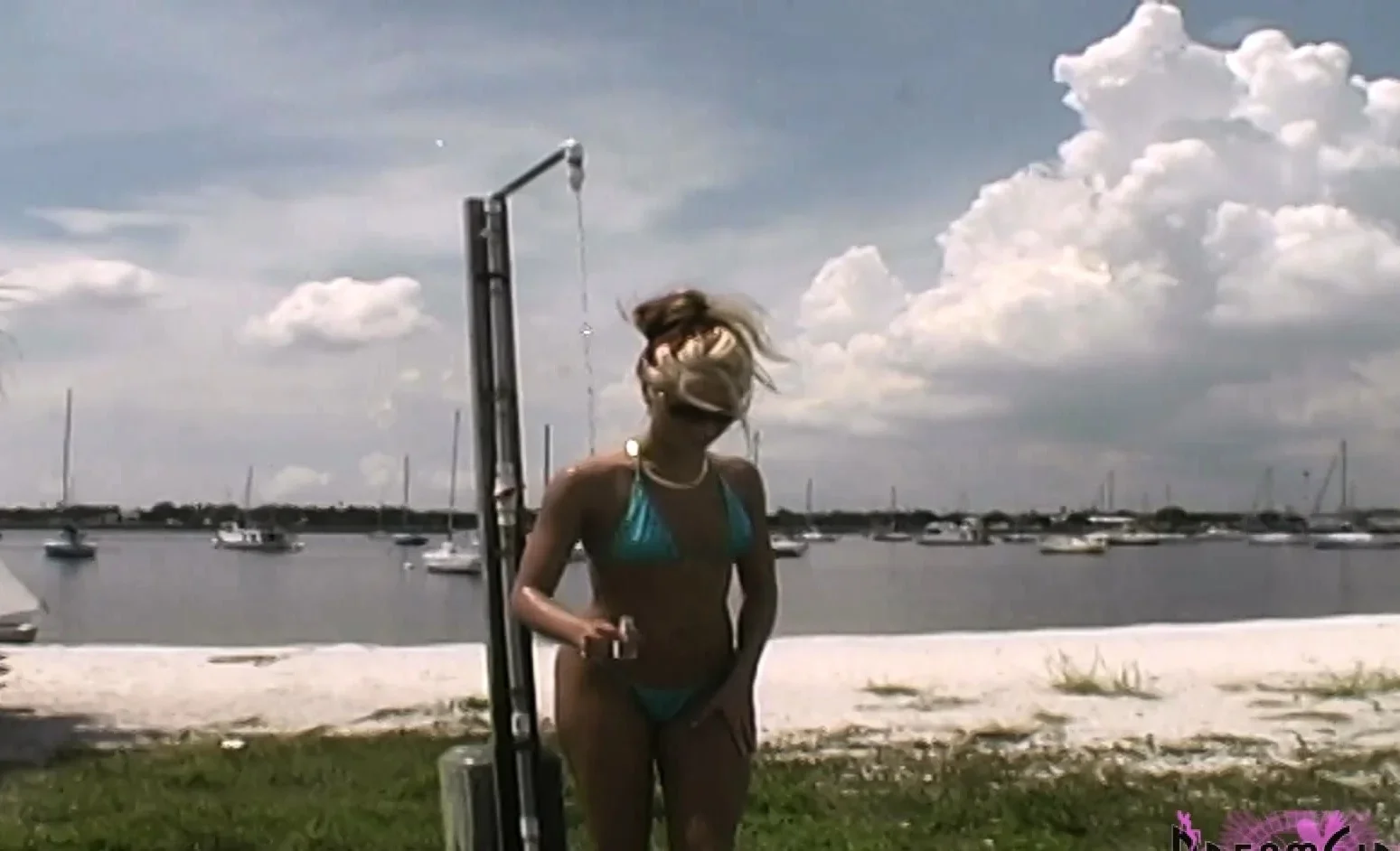She Strips Out Of Her Suit In A Public Beach Shower