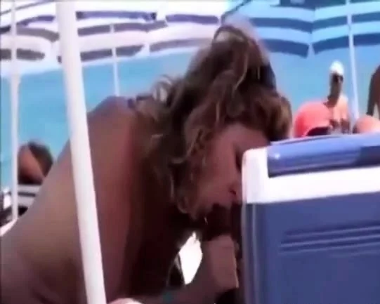 mature sucks black cock on beach