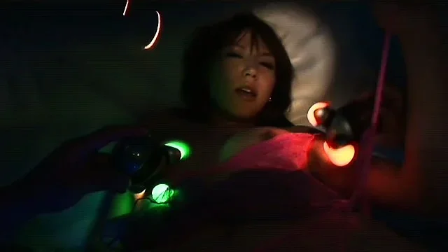 Japanese gal gets played with and fucked by glowing dildos in an awesome scene