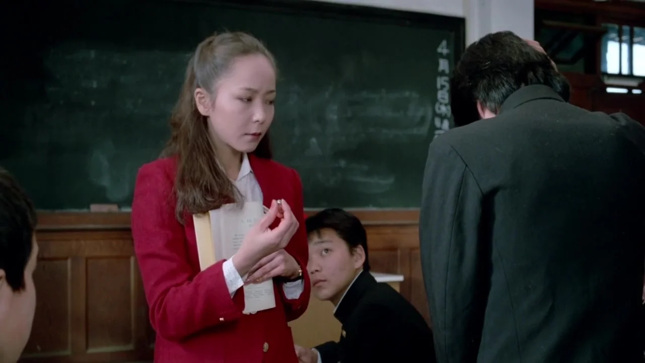 Female Teacher In Front Of The Students1982