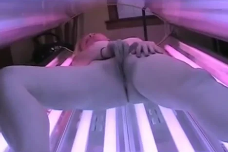 Tanning room - blonde rubs it