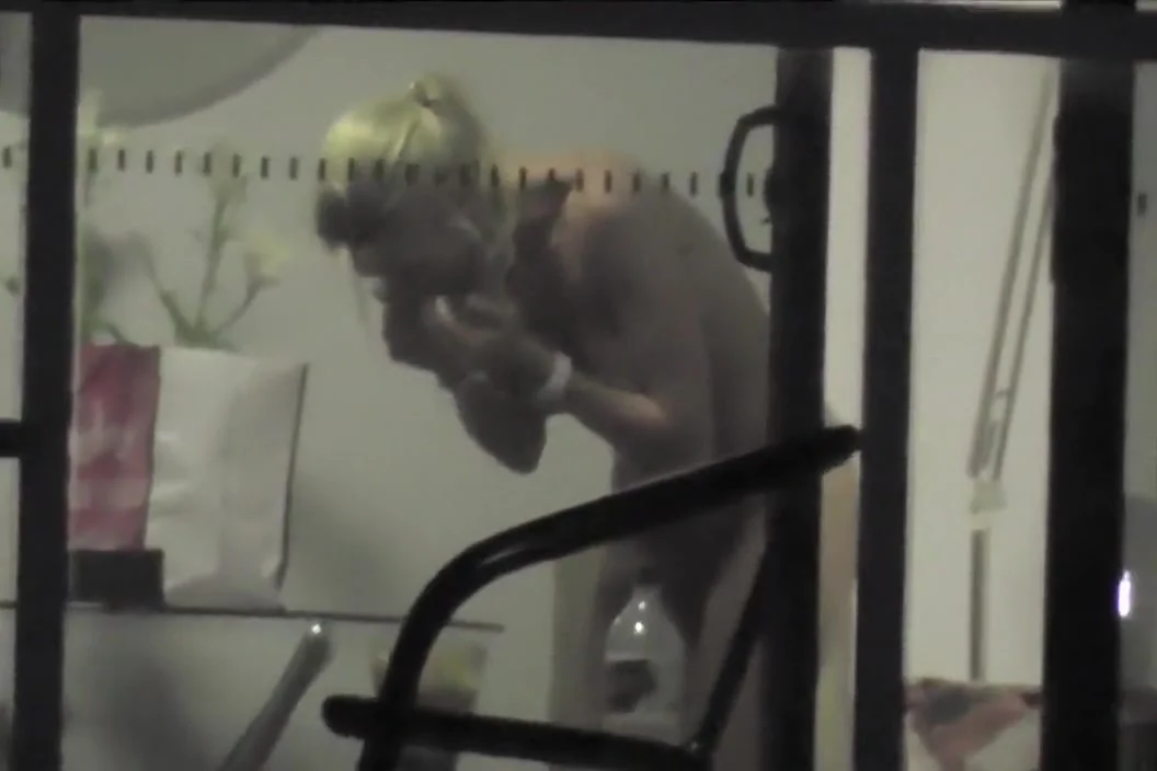 Saucy chickie gets caught on tape taking off her clothes