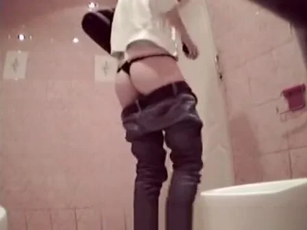 Busy girl peeping in bar toilet