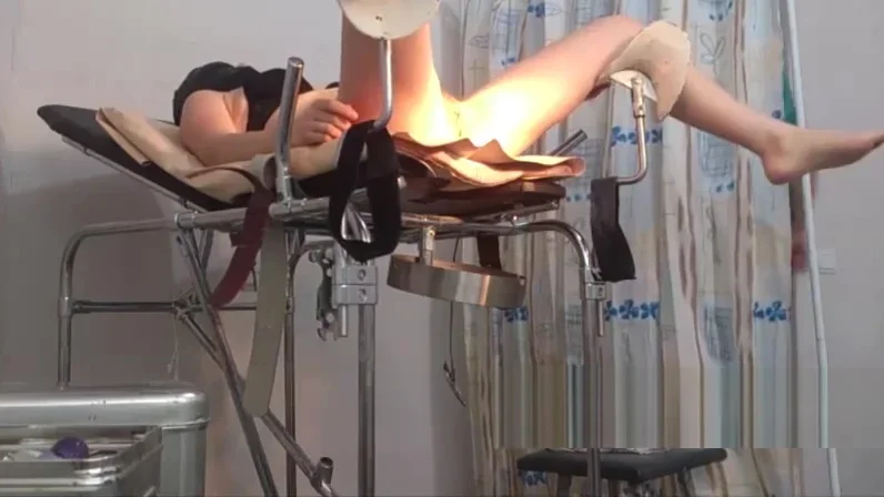 girl in a black mask. exam in gyno chair