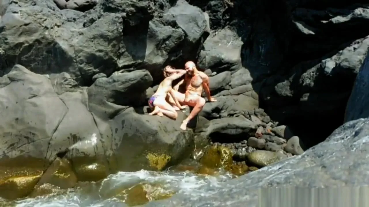 Some couple fucking on the rocks by the sea
