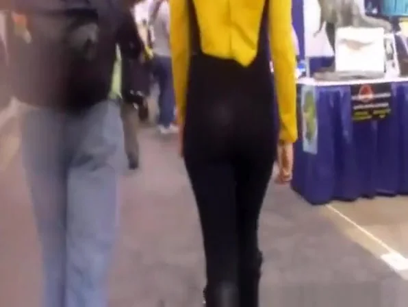 Black thong visible underneath pants