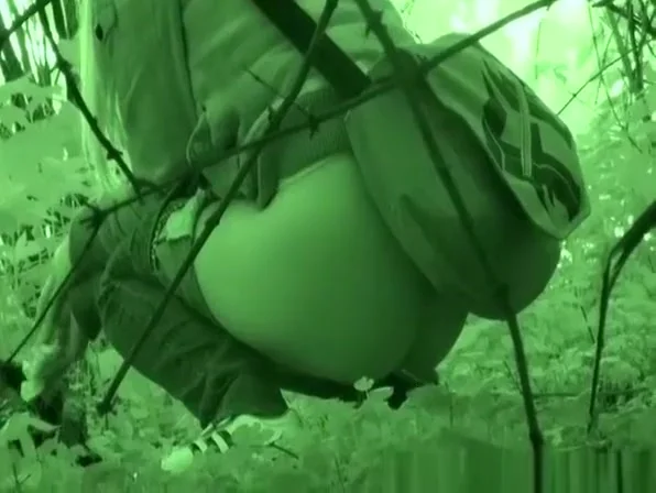 Blonde caught pissing beyond some trees