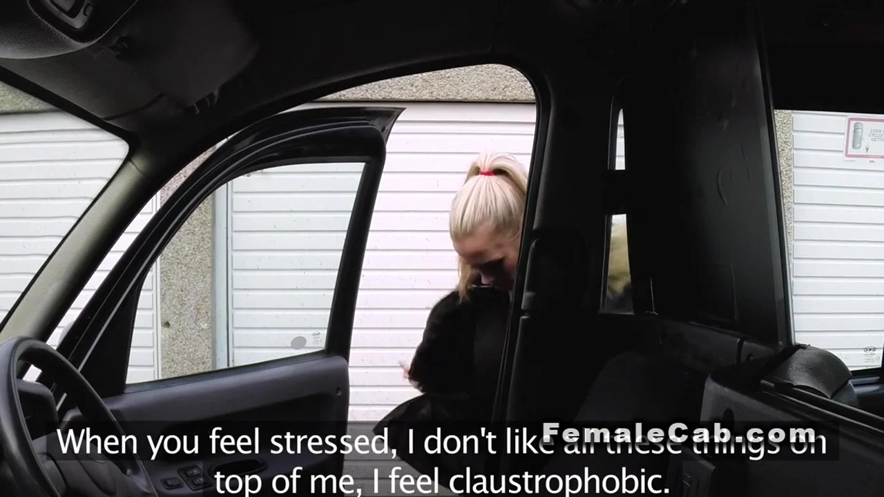 Blonde gets big tits massaged in cab