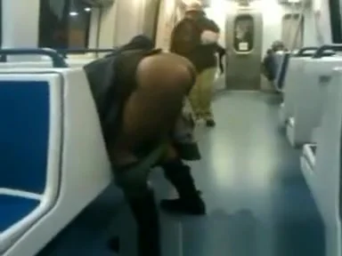 lady pees in subway car