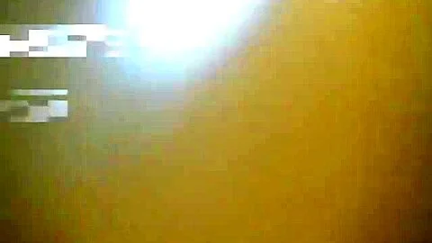 An office woman is peeing in the common office toilet to a pissing