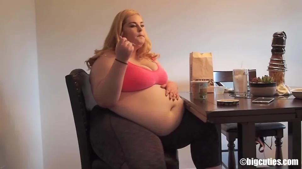 Blonde Plumper Rubs Her Belly While Eating Ice Cream