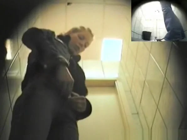 Blonde girl in tight jeans pants peeing