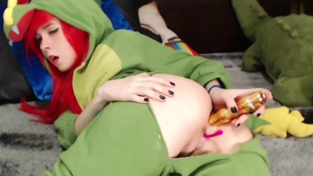 Cute redhead girl in costume playing with her ass