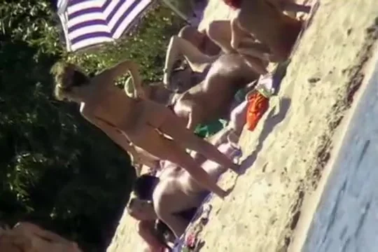 The family that sunbathes in the nude together, stays toget