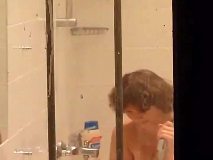 Mature lady peeped on in a bathroom