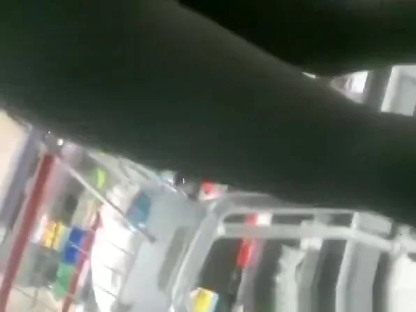 Woman in black leggings in supermarket