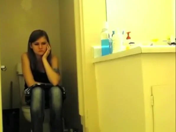 teen 18+ with tattooed arm pissing