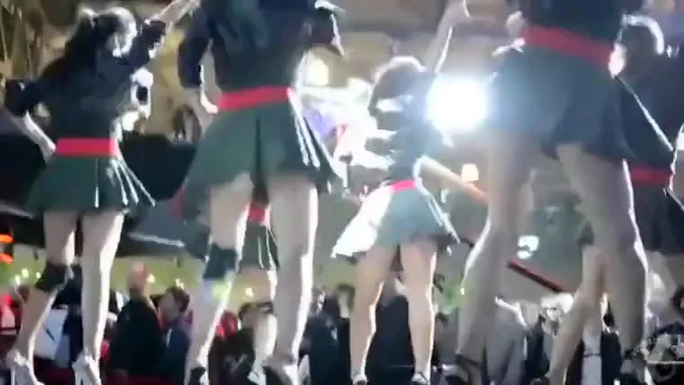 Short pleated skirts and heels on sexy dancing girls