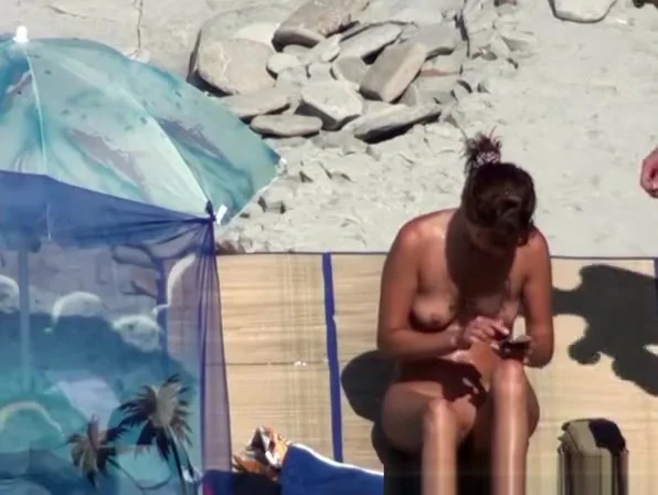 Small boobs woman spied in beach