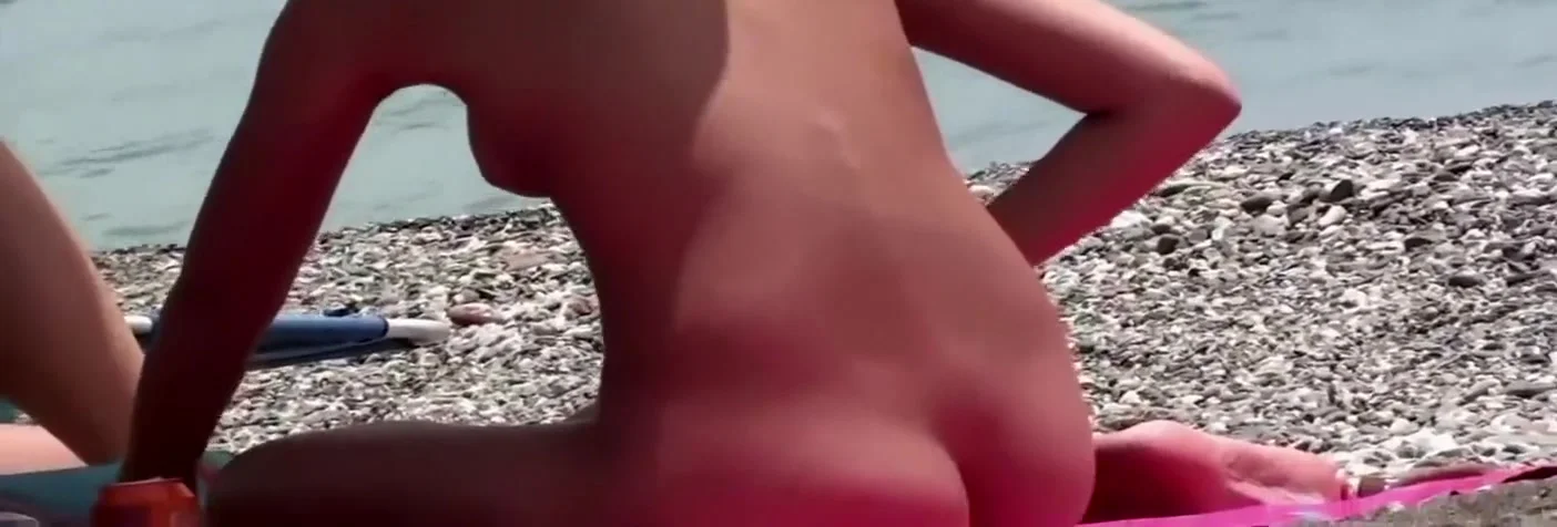 Cute nudist girl filmed at the beach