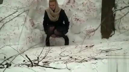 Russian maid gets caught peeing in the snow