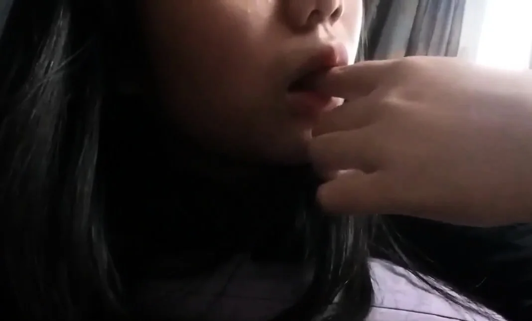 Asian girl fucks herself with a cream tube on a webcam