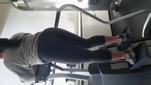 Sporty girl in tight black sports pants