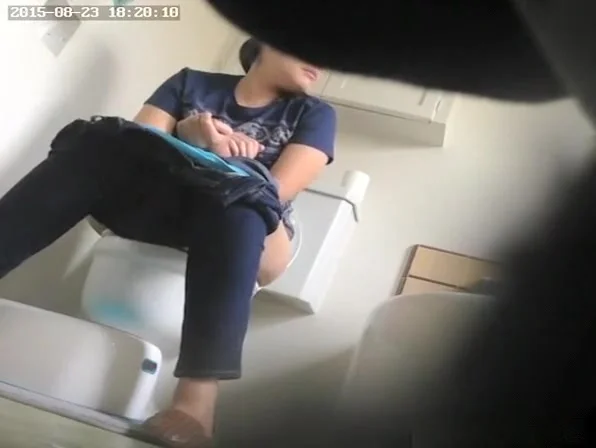 Woman seating in toilet and pissing