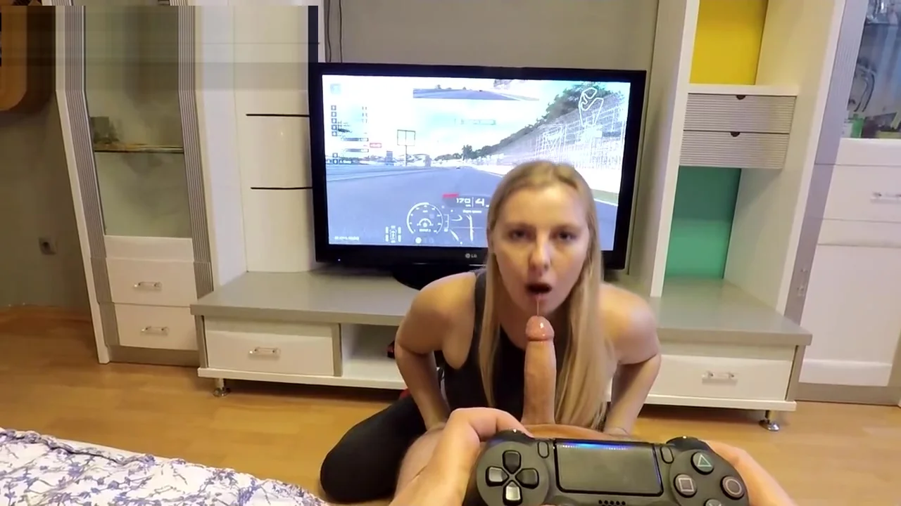He plays GT Sport while she sucks his cock