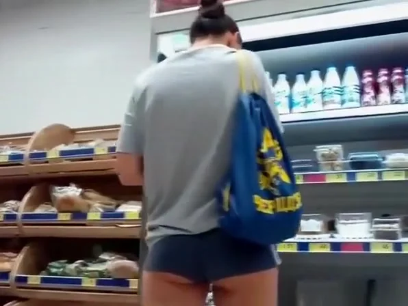 teen 18+ at the supermarket wearing tight shorts