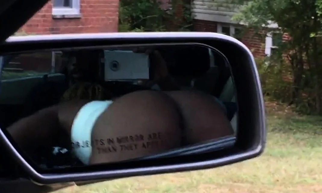 Black slut sucking dick in front seat of car