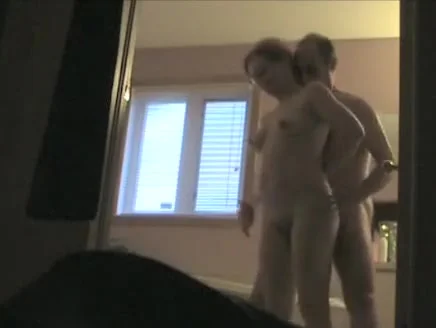 Fooling around with his wife in the bathroom