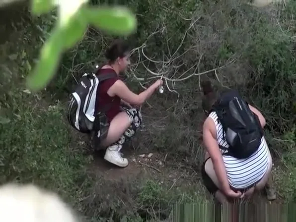Two women caught peeing in the nature