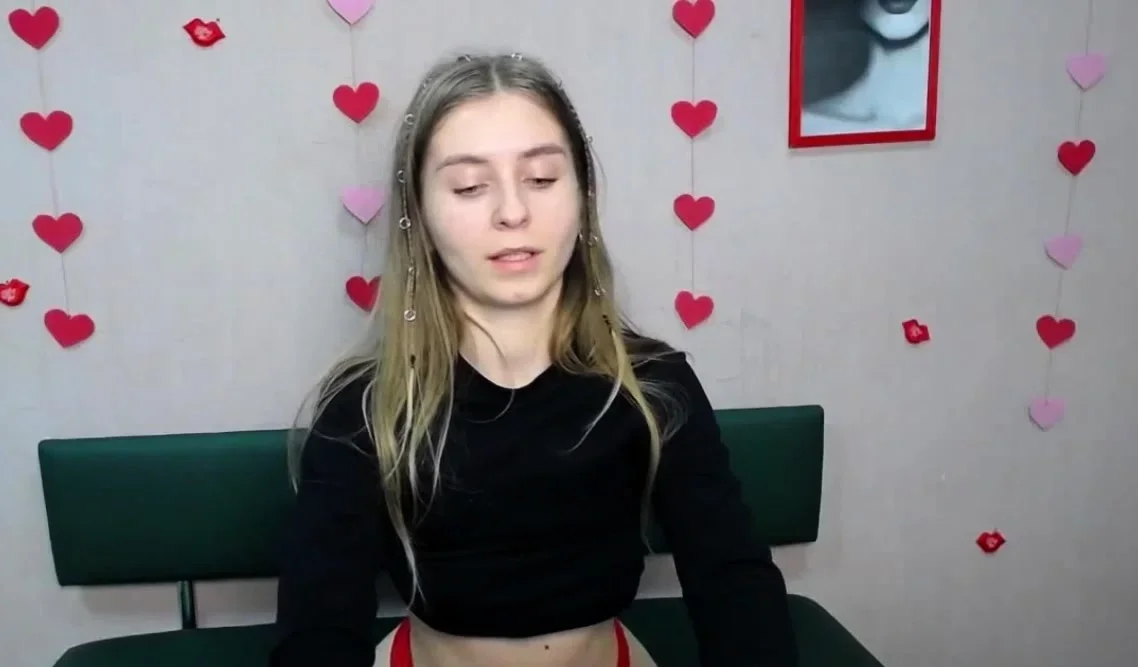 Young Ukrainian blonde in red panties posing on webcam show