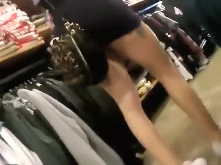 Two sexy teen 18+ girls in a clothes store