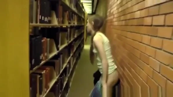 Naked girl in library