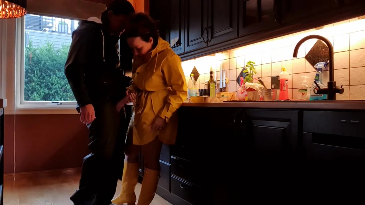 Foreplay In Rainwear In The Kitchen