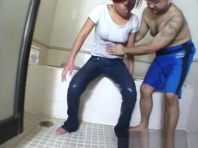 Helping a young woman in wet jeans in the bath