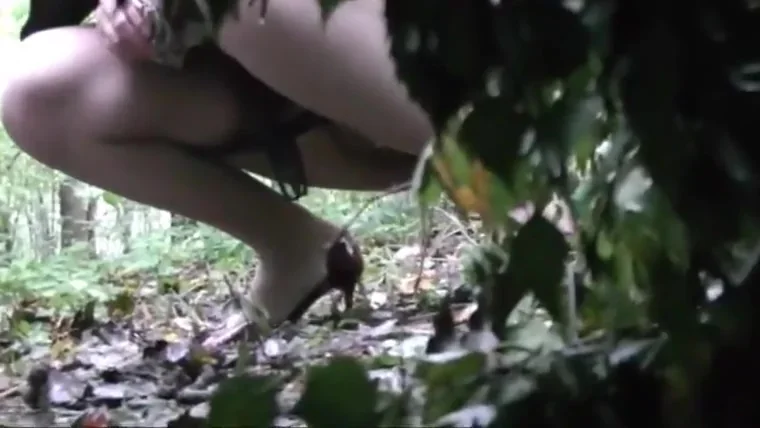 is spying and recording two girl pissing in the wood
