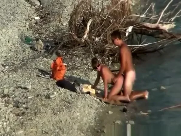 Nudist couple fucking by the water