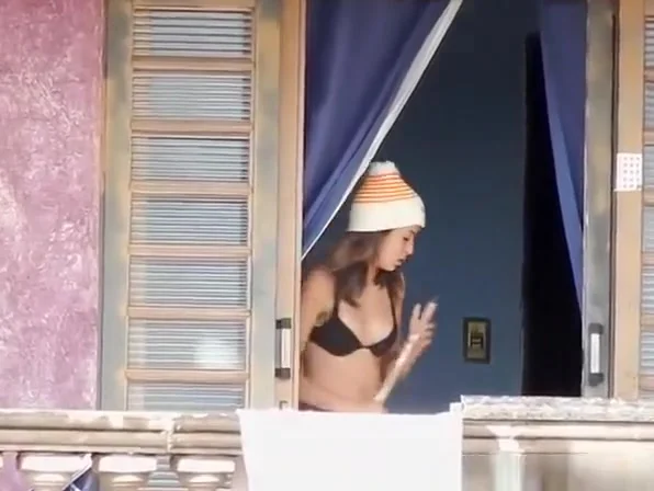Neighbor in black underwear cleaning